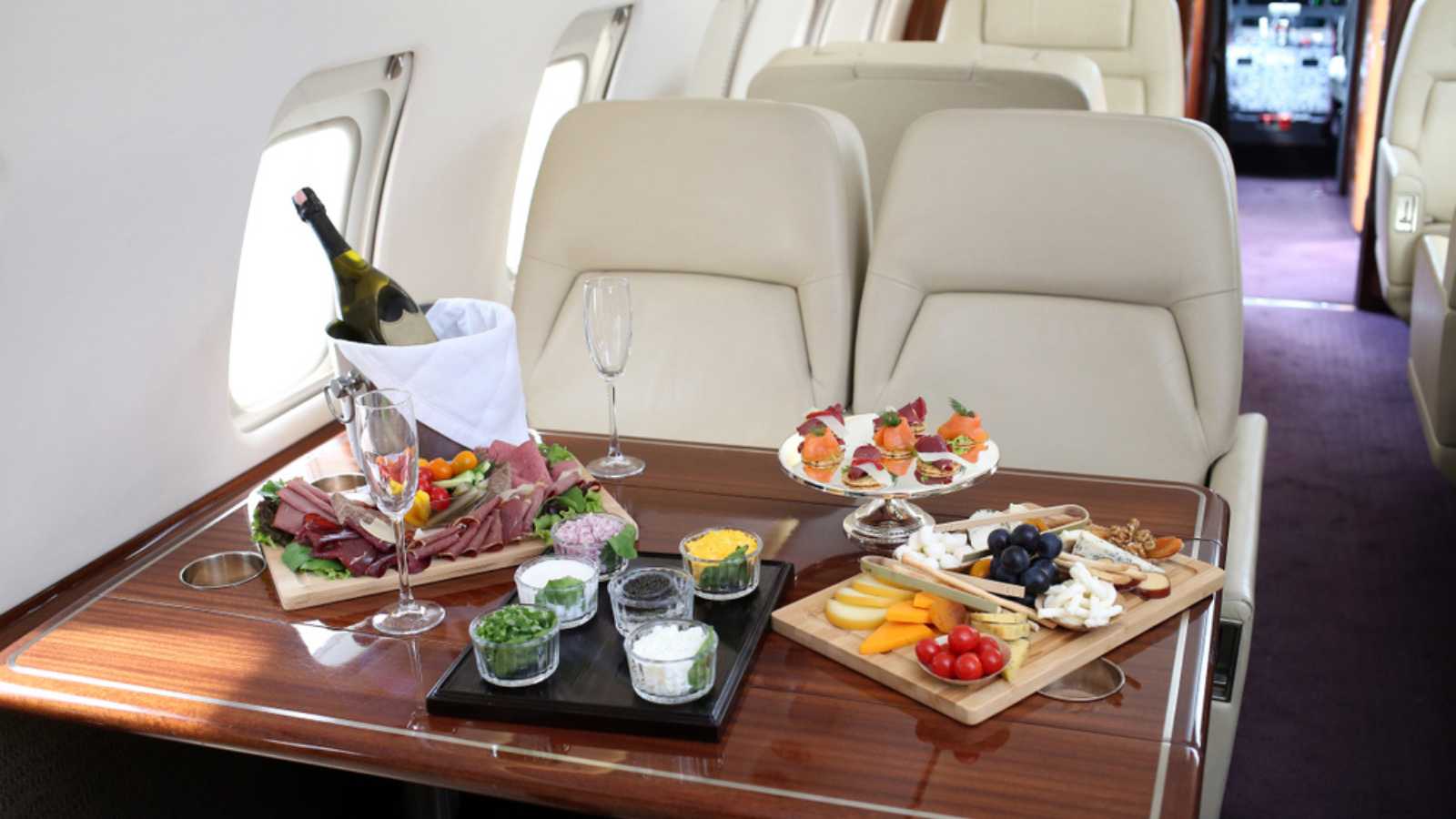 Tray with delicious food on the plane, business class travel