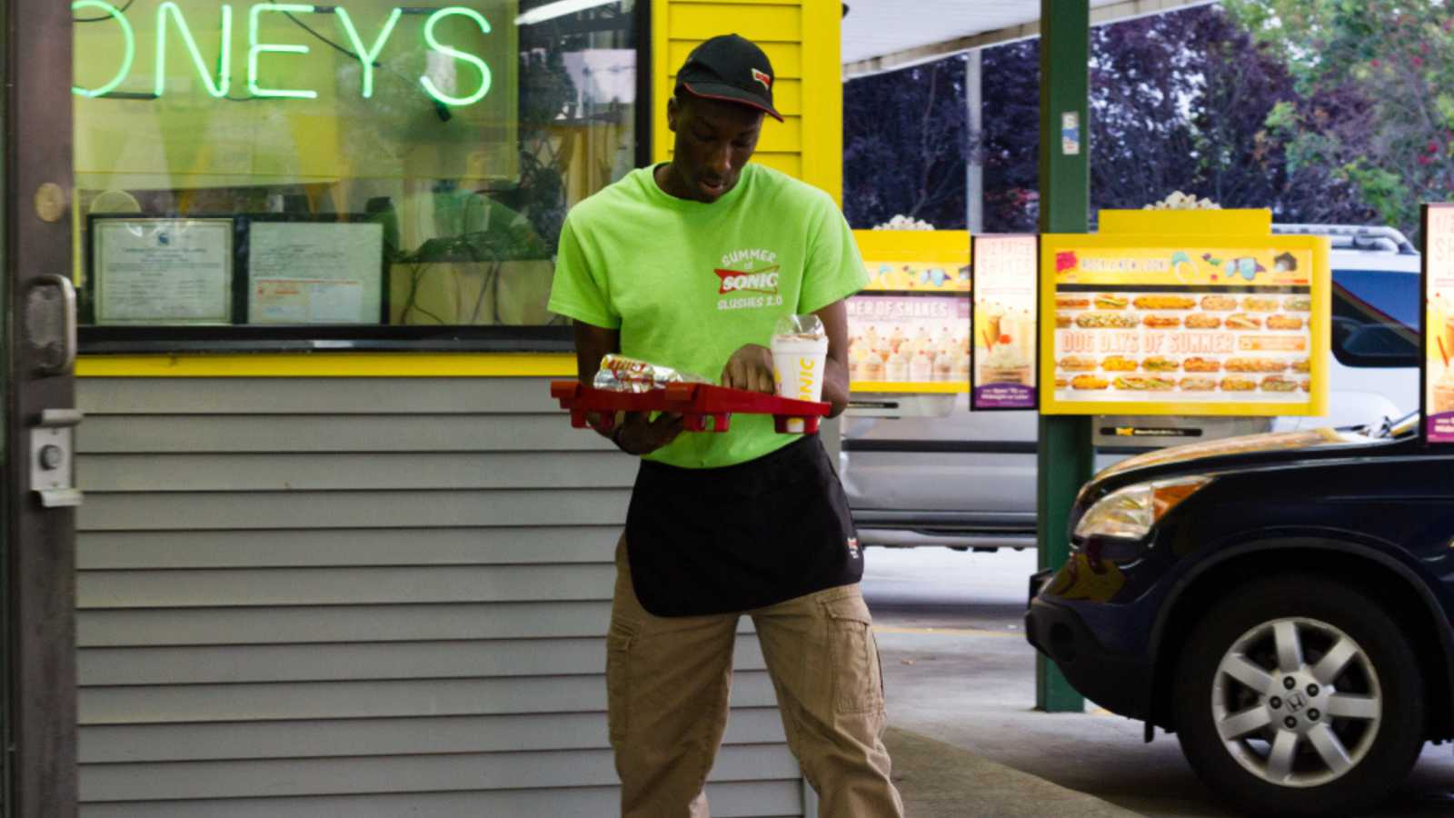 Greensboro, North Carolina / United States of America - July 30 2014: Sonic Fast Food restaurant chain with male waiter on roller blades to serve food