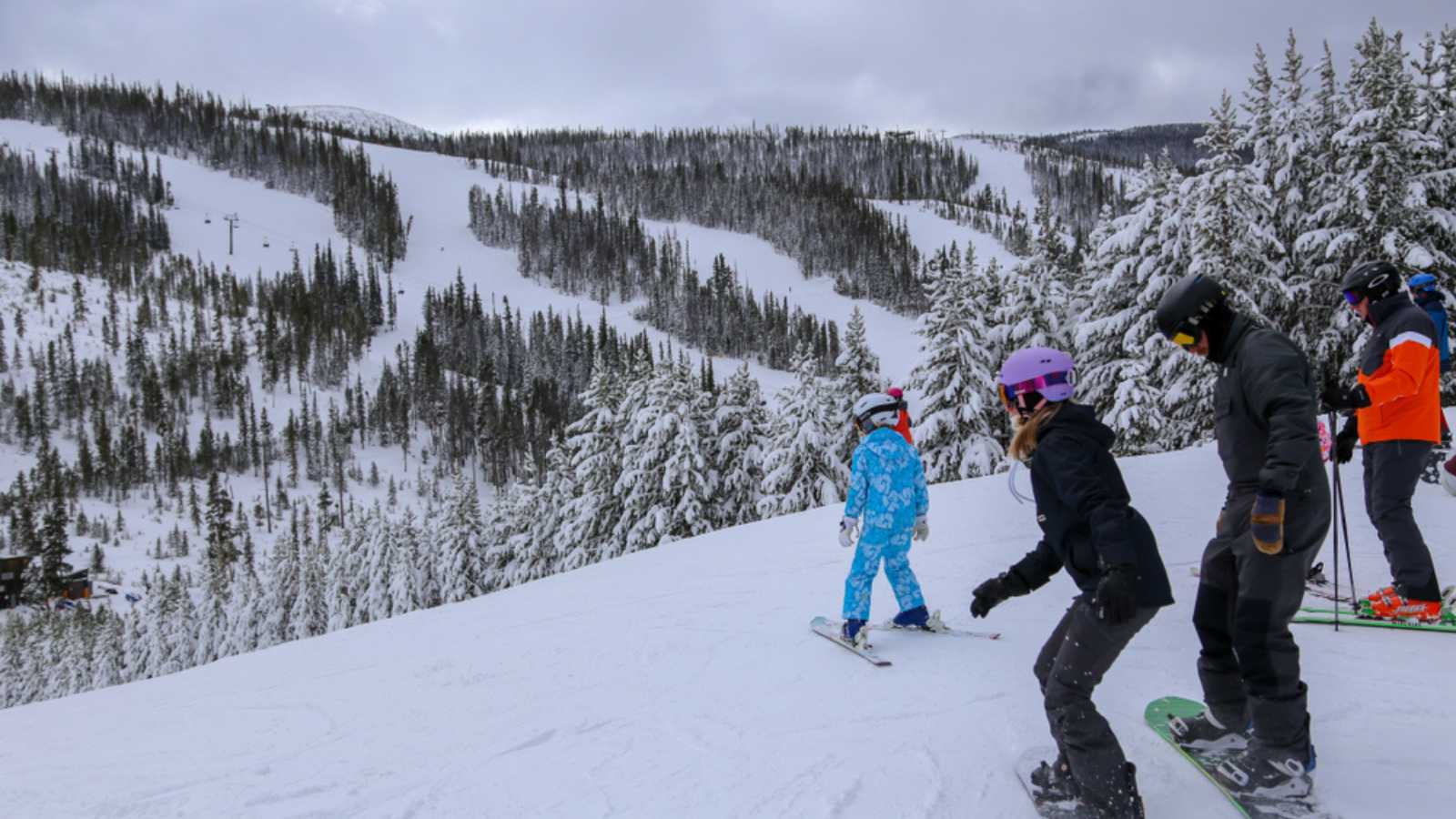  People skiing downhill at Winter Park Resort in Colorado