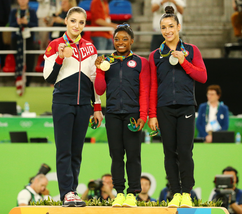 Aliya Mustafina of Russia (L),Simone Biles of USA and Aly Raisman of USA during medal ceremony