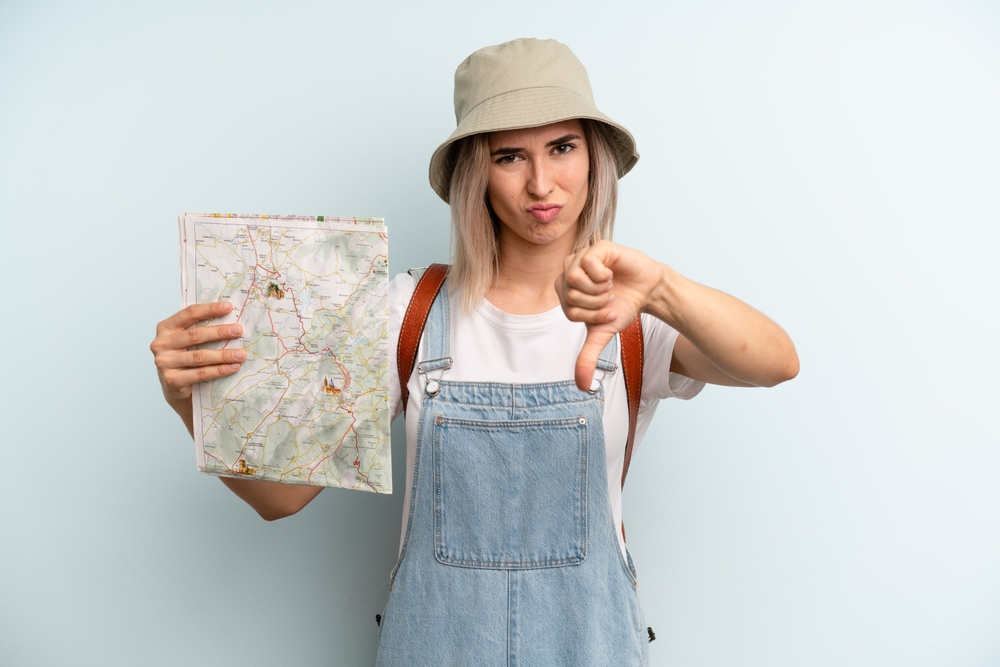 Disappointed woman with map