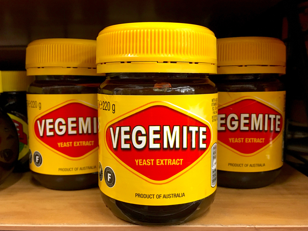 Grocery store shelf with jars of Vegemite brand Yeast Extract