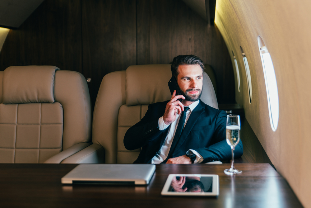 Wealthy man on plane.
